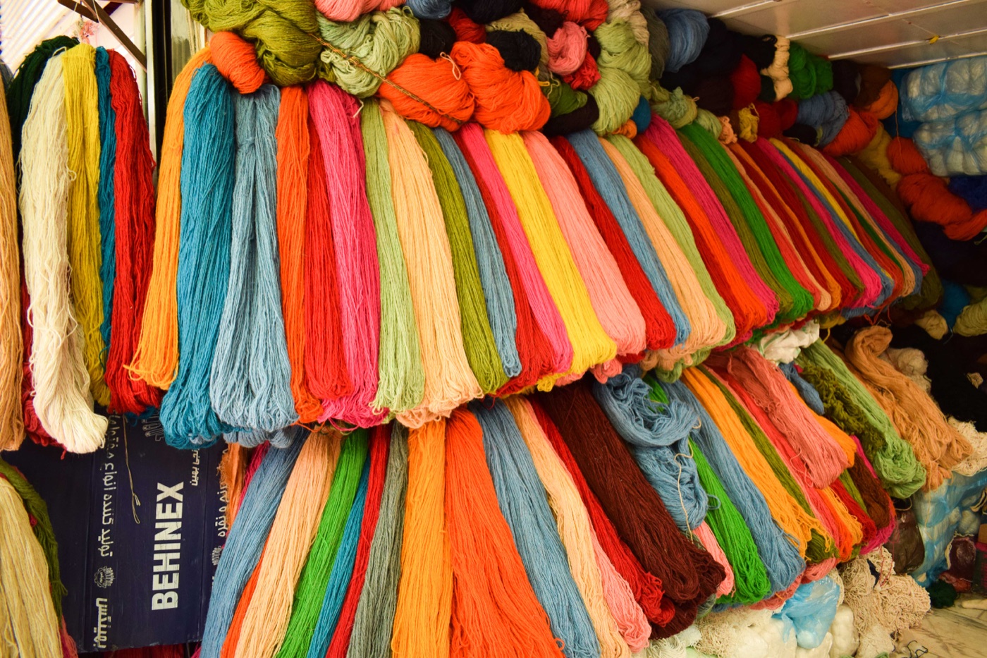 Brightly colored skeins of yarn in Sanandaj's old bazaar
